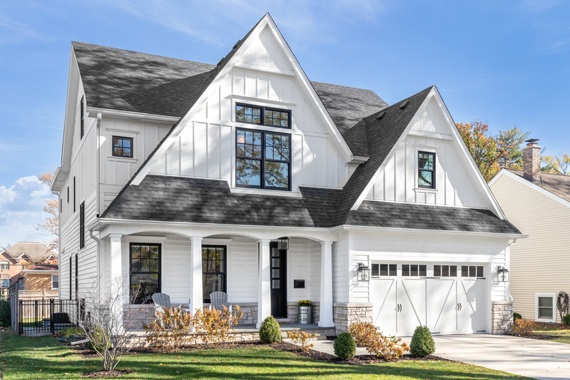 Double-hung replacement windows installed in modern home exterior.